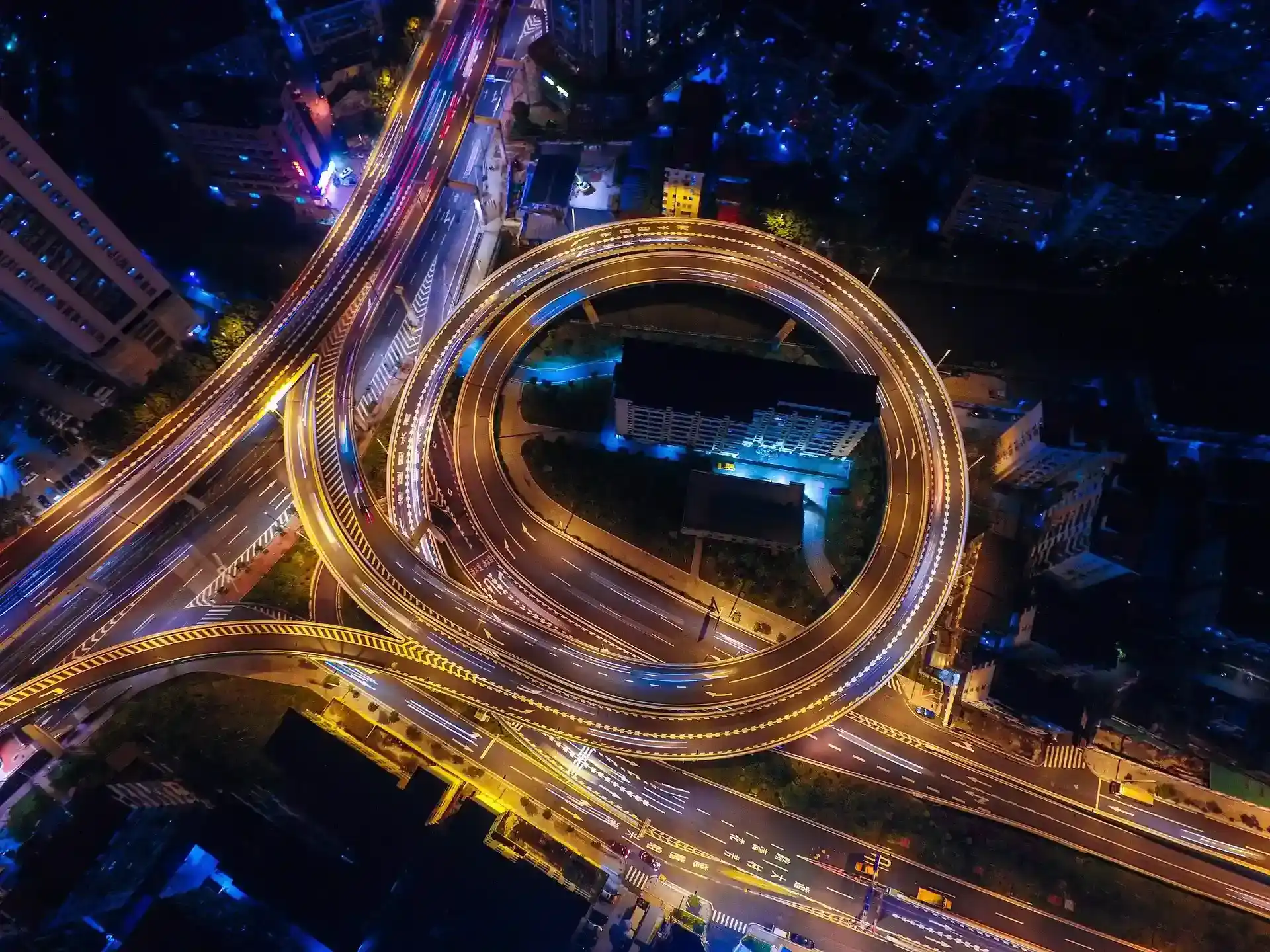 Highway interchange at night with traffic
